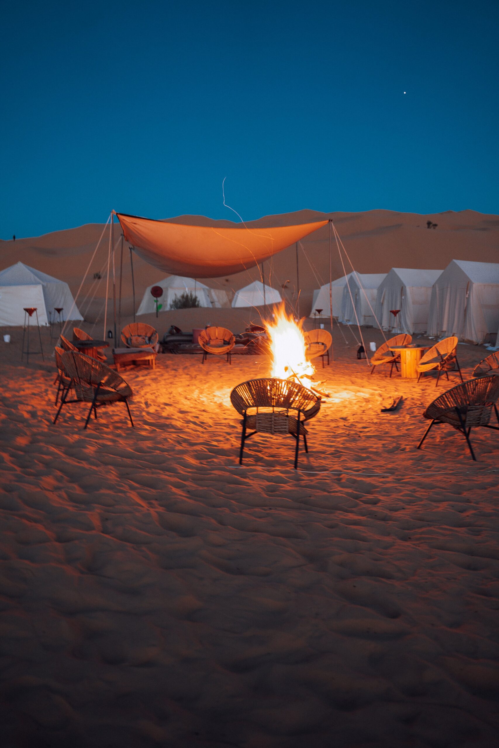 Camp Mars luxury desert camp illuminated under a starlit sky in Ong Jmel, Tunisia