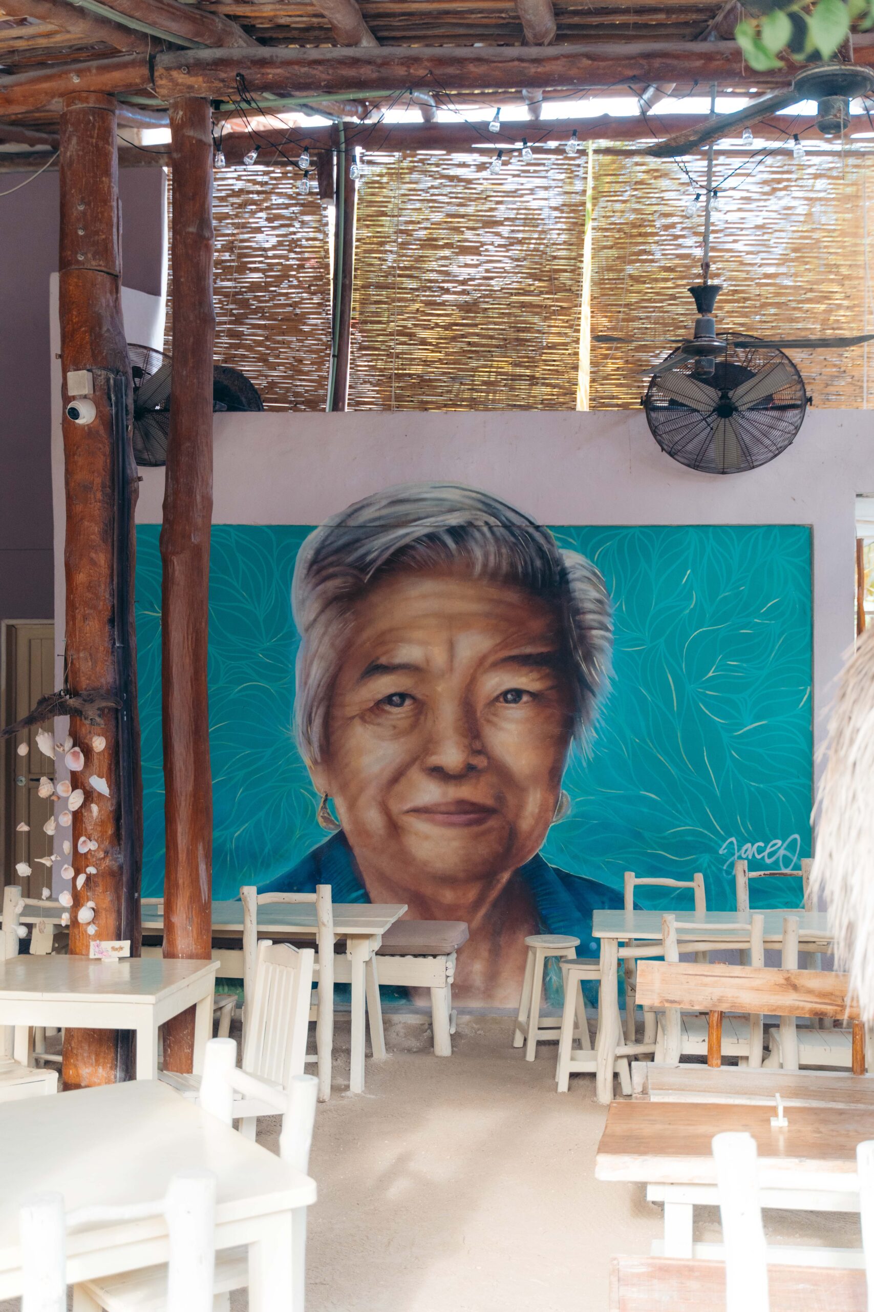 Mural of an old woman inside a restaurant in Holbox