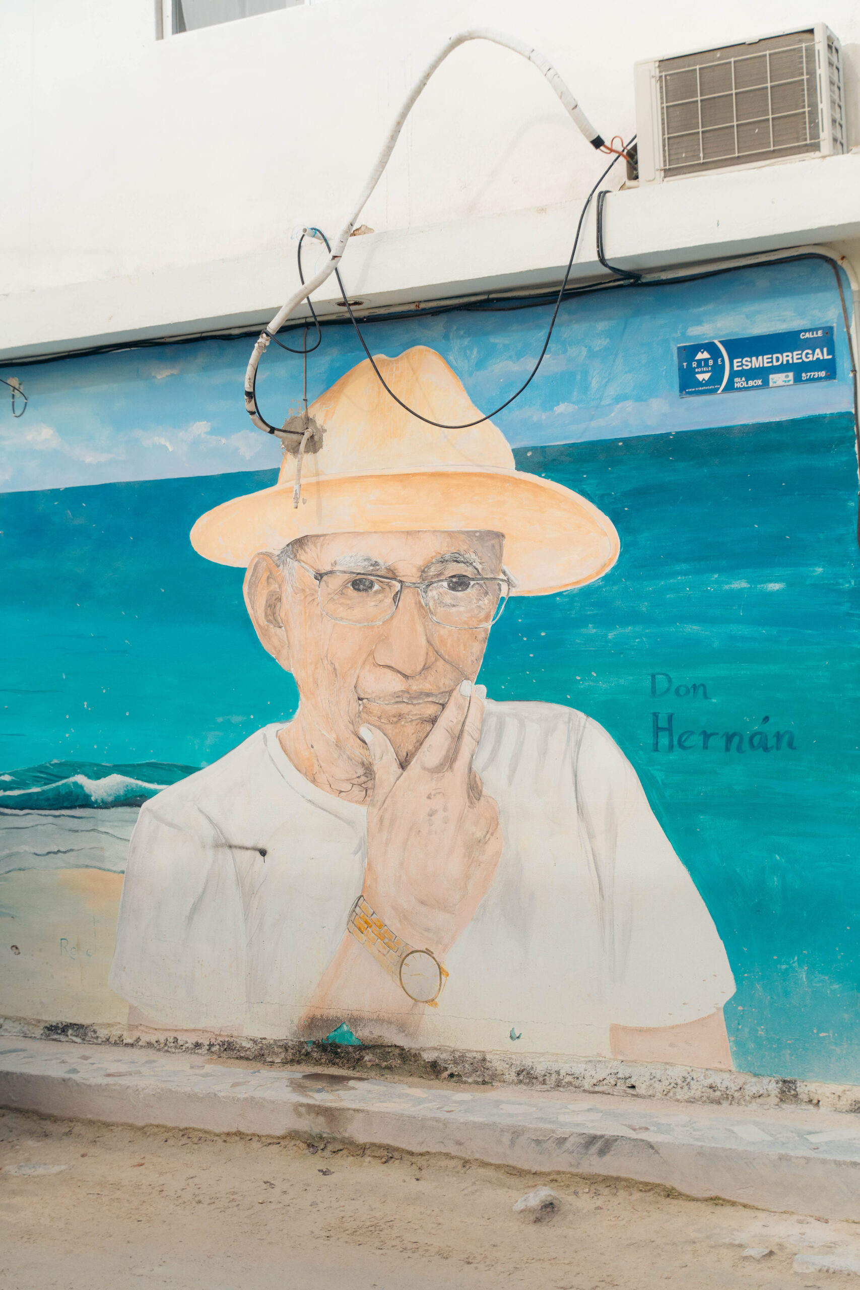 Mural titled 'Don Hernan' on Calle Esmedregal in Holbox.