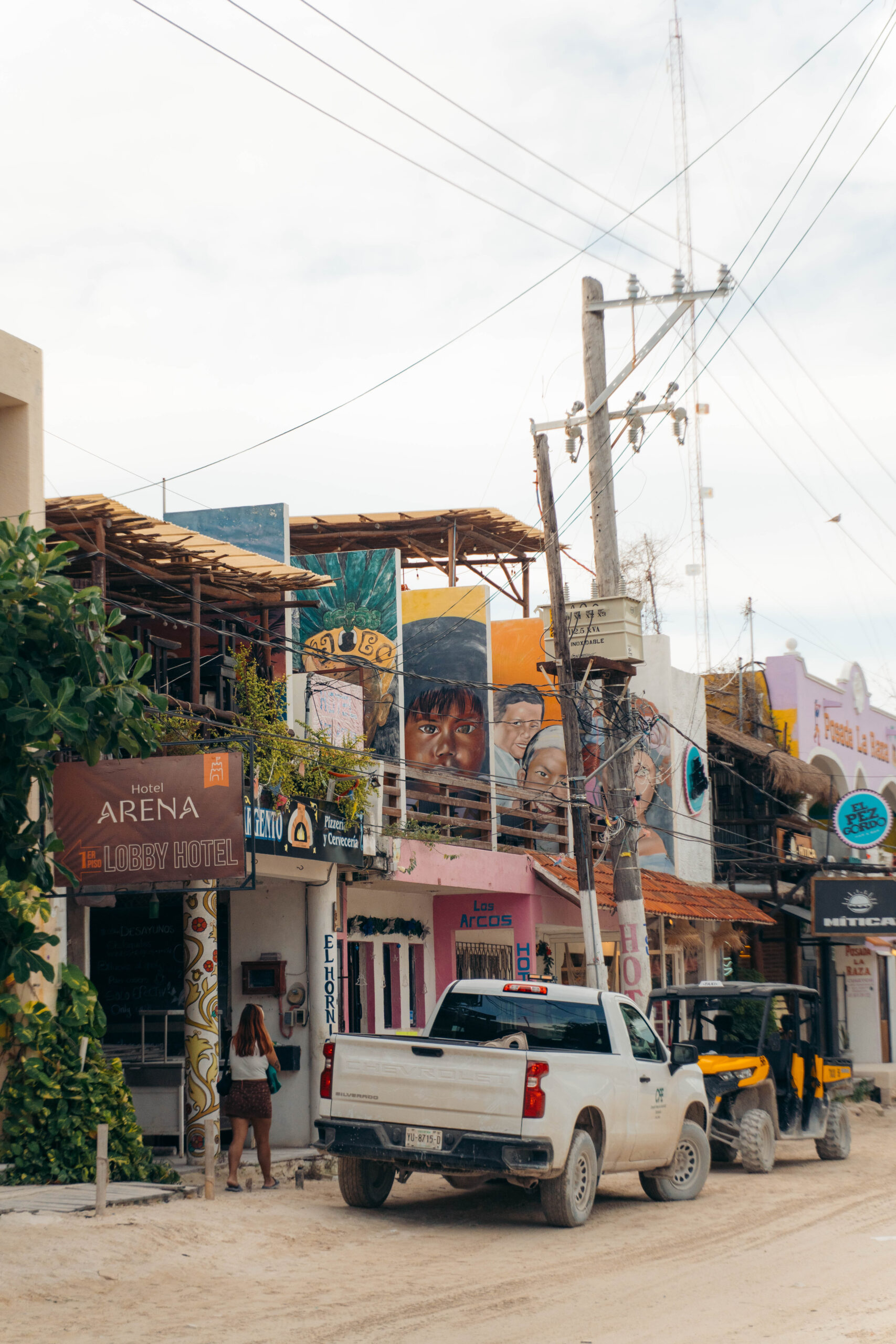 Multiple murals above Hotel Arena in Holbox town center.